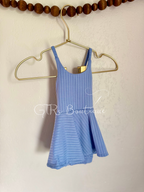 Baby skirted bodysuits with crissed crossed straps