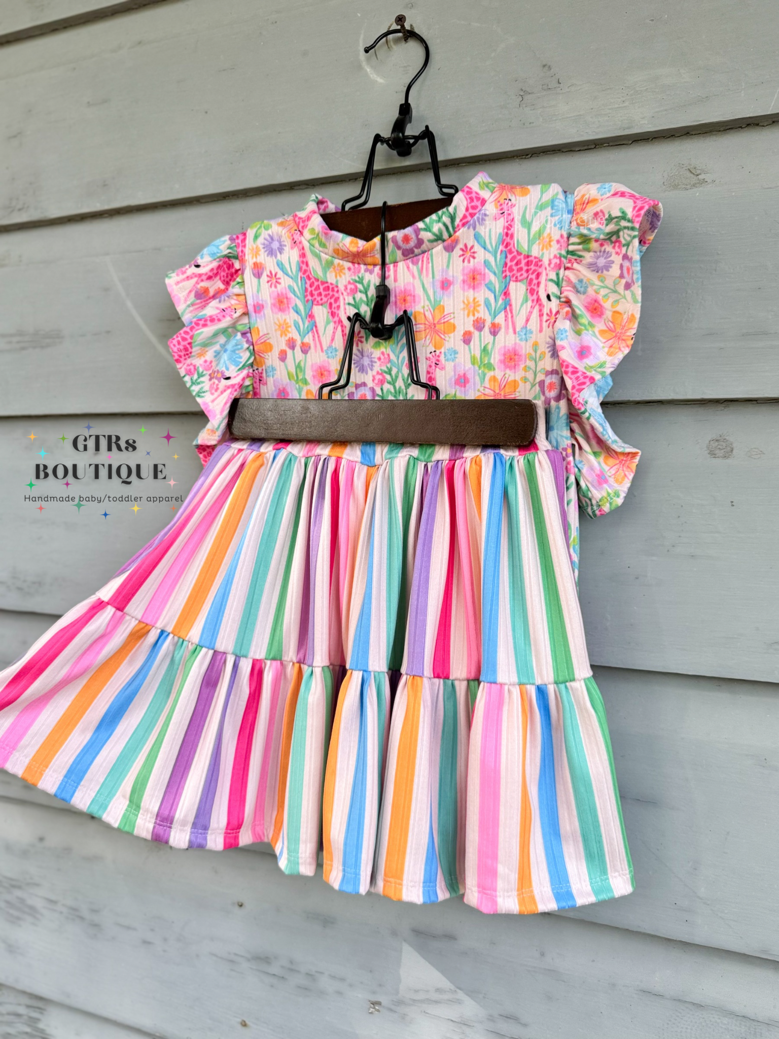 Striped toddler girl skirt, giraffe print toddler girl top, multi color girls outfit, bright rainbow colors, cute toddler girl outfit with ruffle sleeves, toddler girl casual summer outfit, back to school toddler girl outfit 
